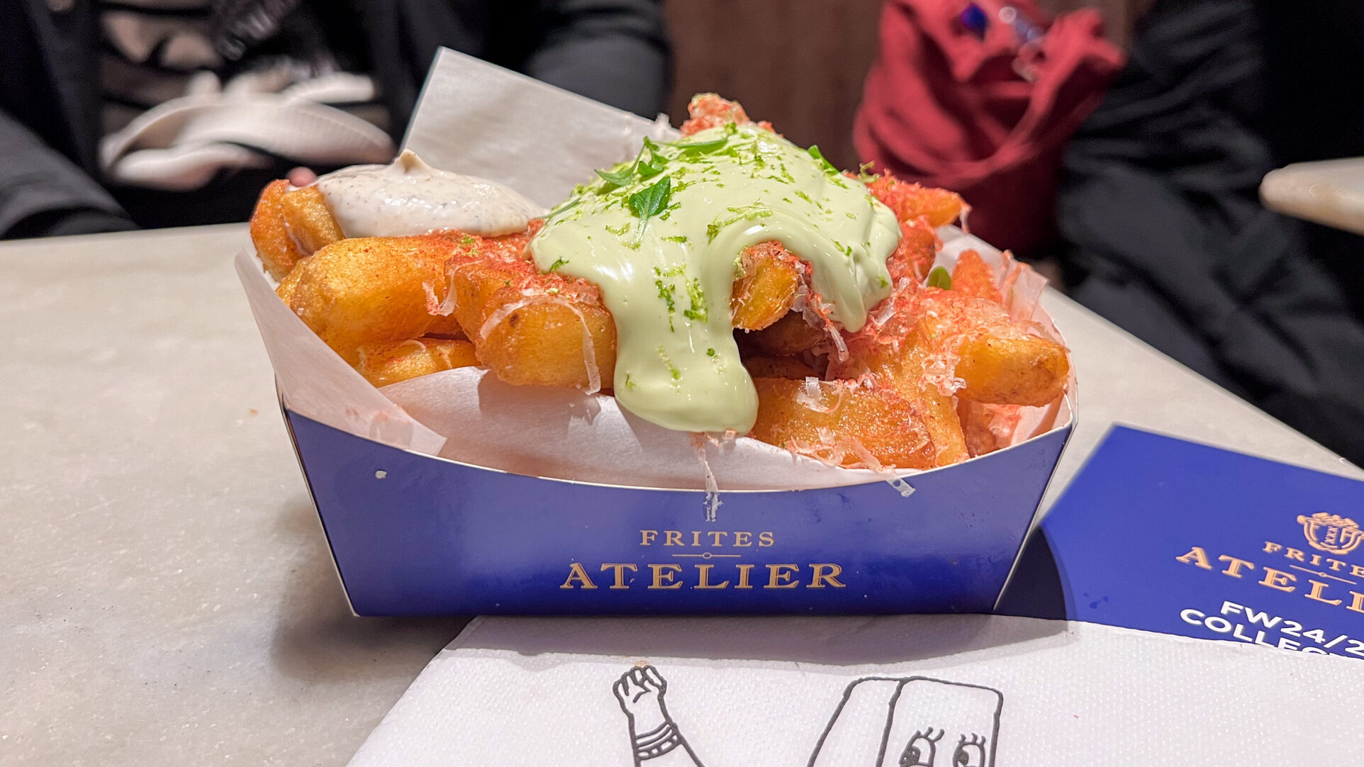 Thick Belgian fries with green sauce. 