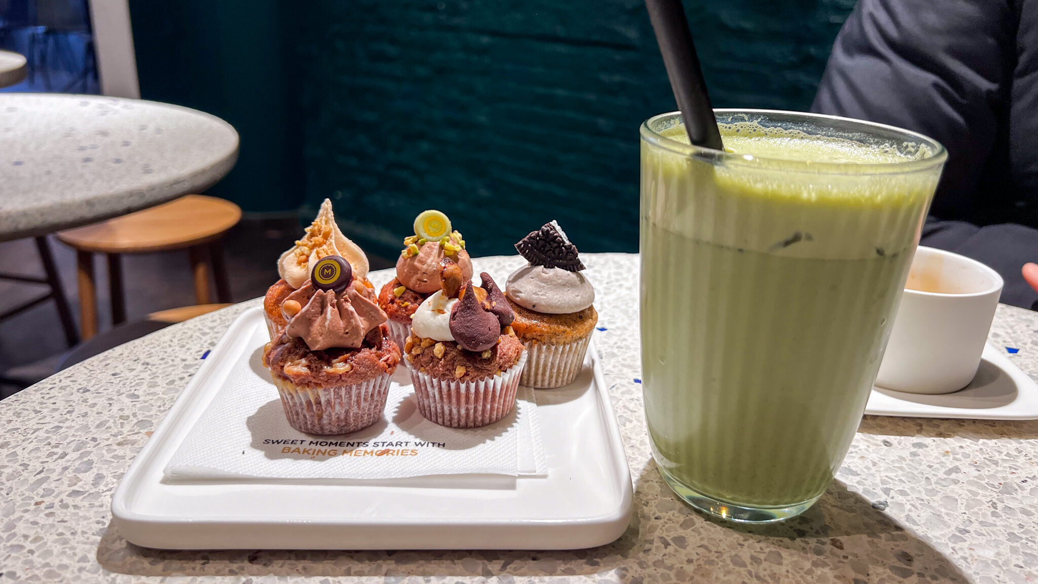 Bite sized cupcakes with iced matcha latte.