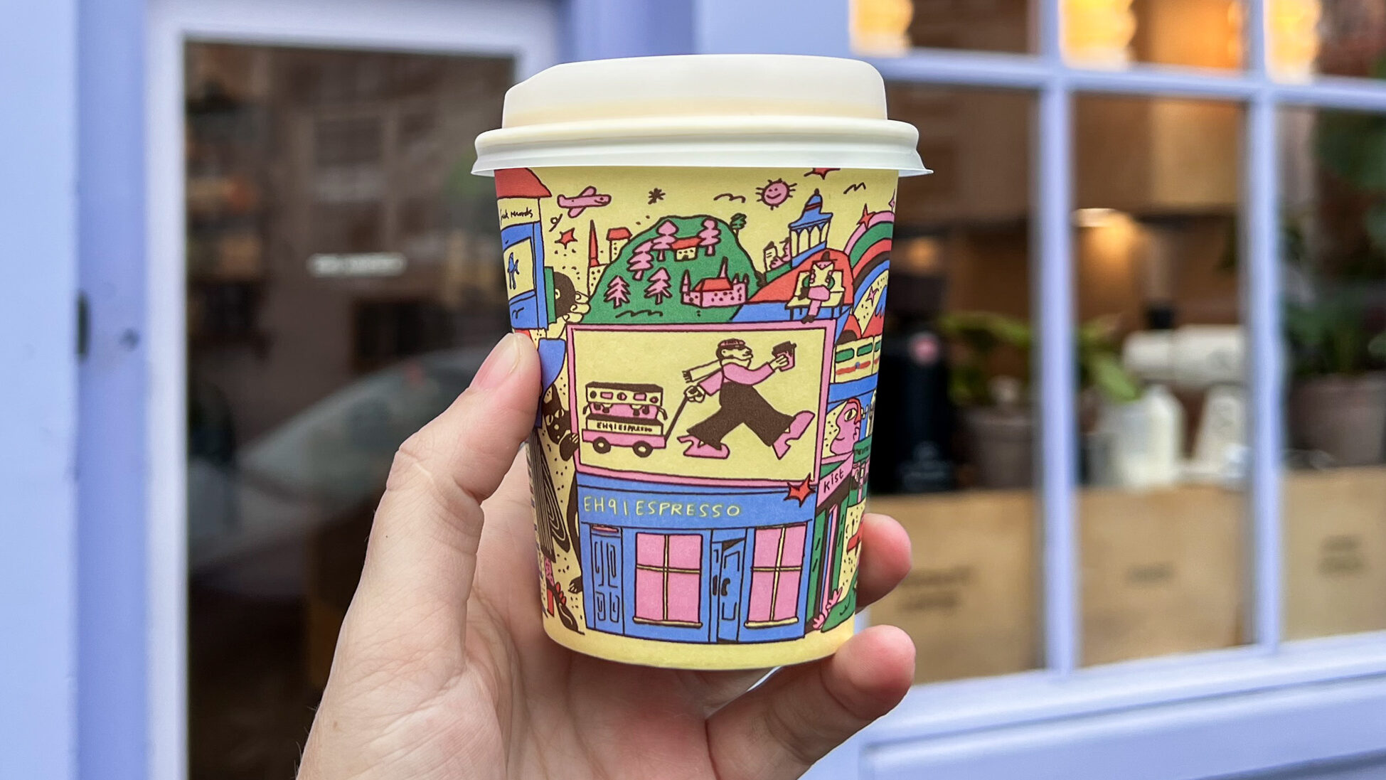 Coffee cup with graphic design on it.