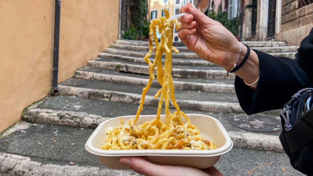 Fresh carbonara in takeaway container.