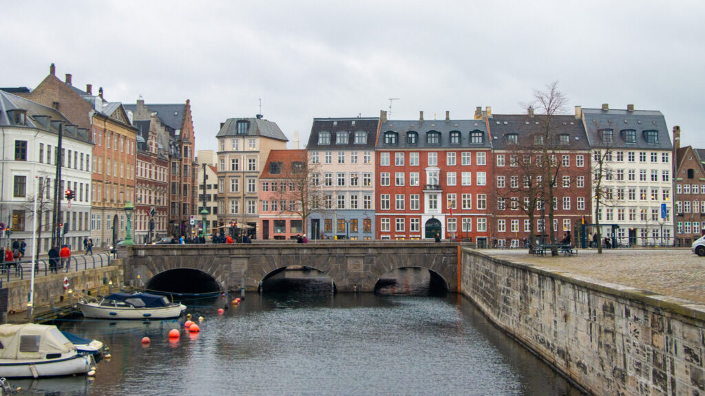 Canal in front of colourful houses in Copenhagen.