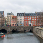 Canal in front of colourful houses in Copenhagen.