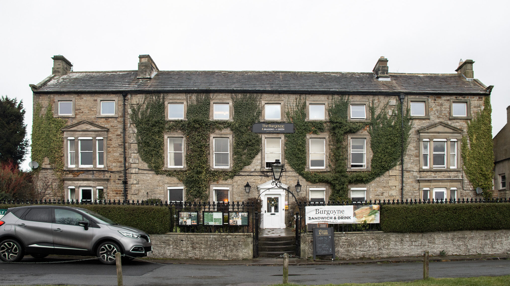 Exterior of historic hotel in Yorkshire countryside.