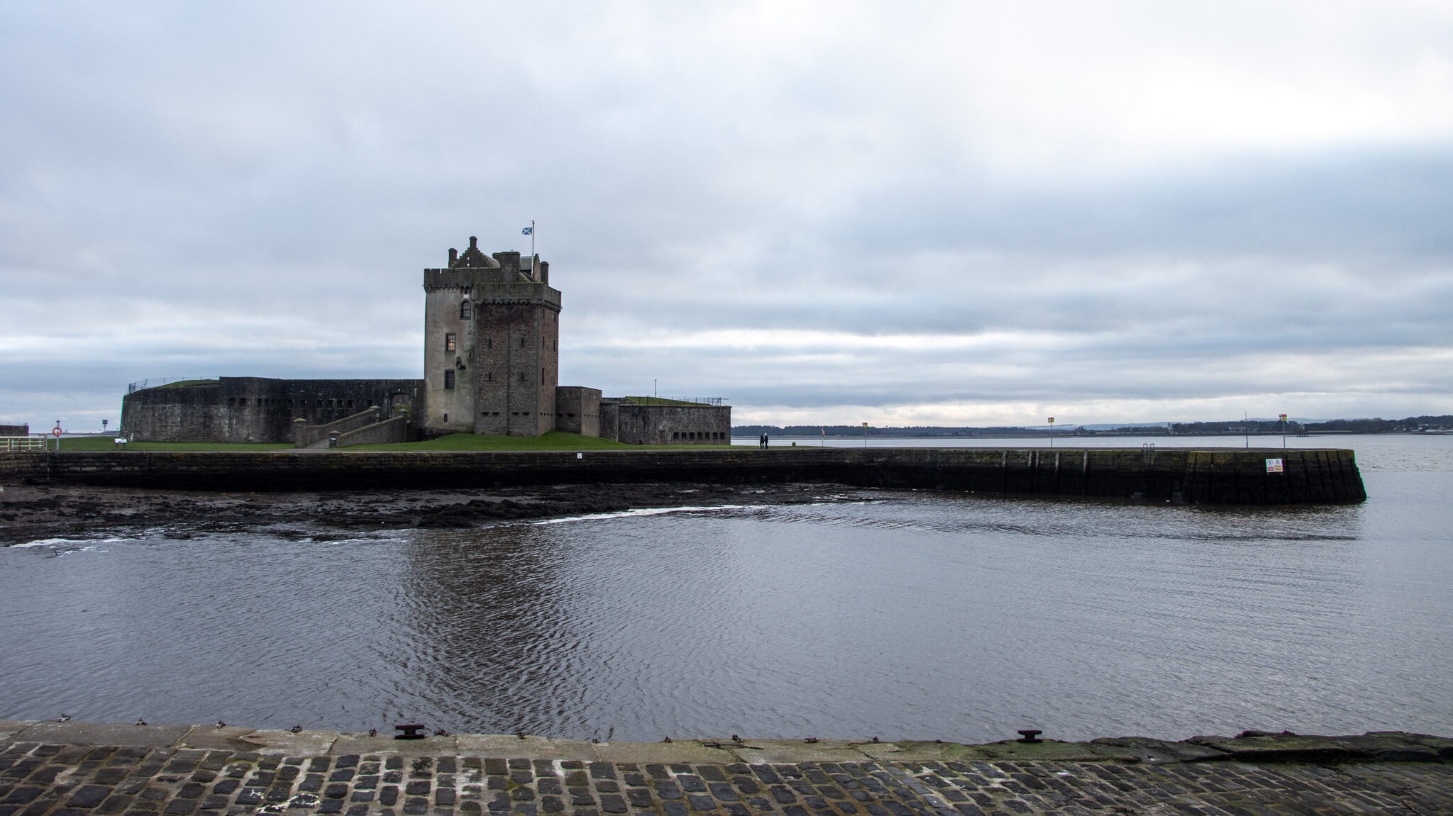 View of medieval castle along waterfront.