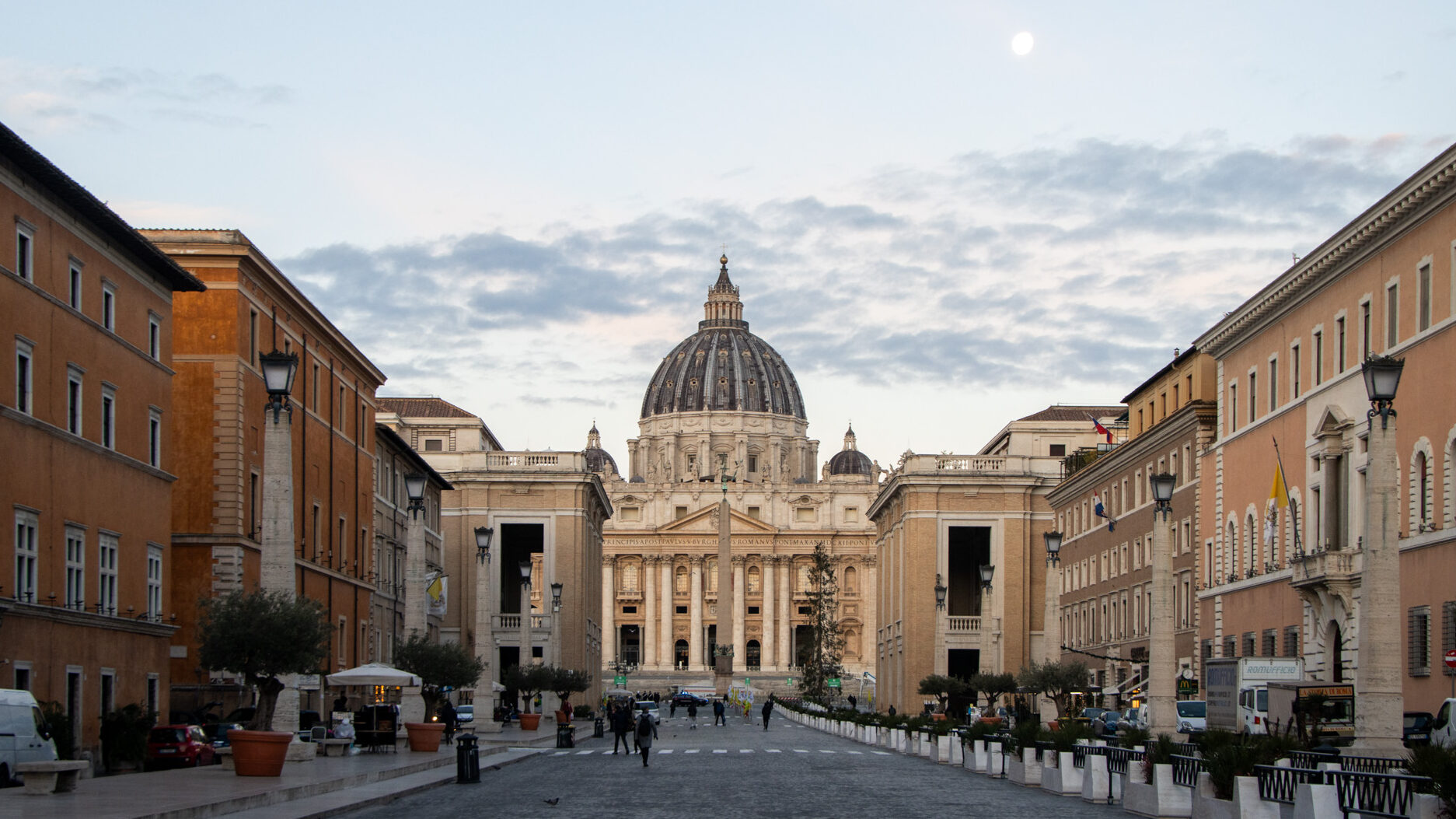 Street leading up to basilica at sunrise.