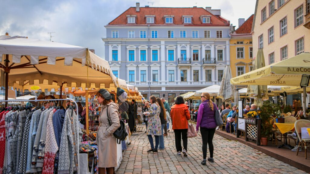 Clothing market in historic town square.