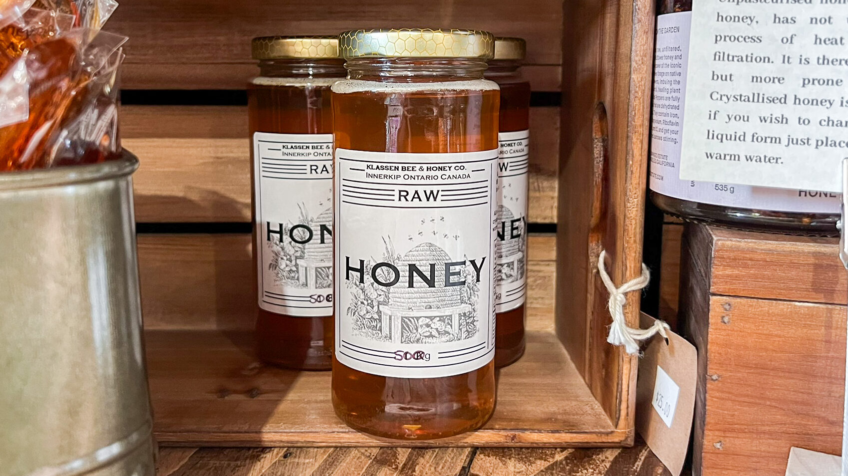 Candles Ontario | Krista the Explorer Glass jar with fresh honey inside.