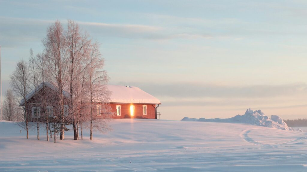 Small house and snowy landscape in the Arctic.
