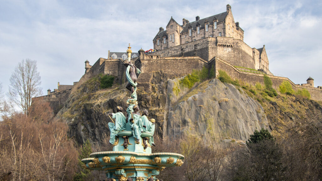 Fountain in garden with Edinburgh in background.