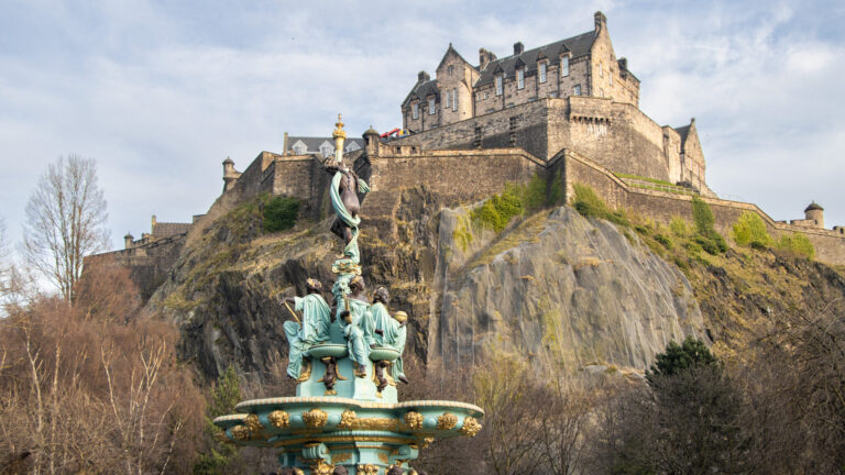 Fountain in garden with Edinburgh in background.