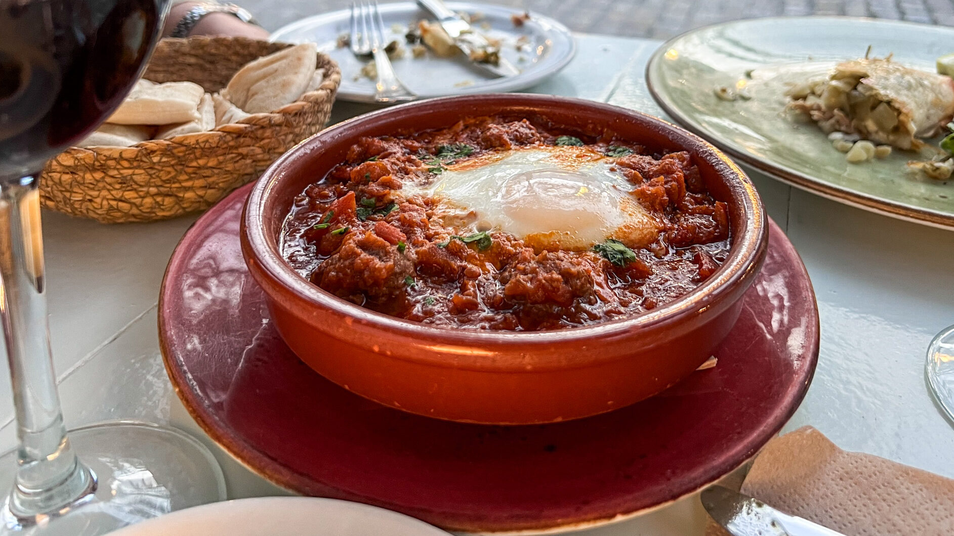 Califa Express Vejer | Krista the Explorer Moroccan tapas dishes with red wine.