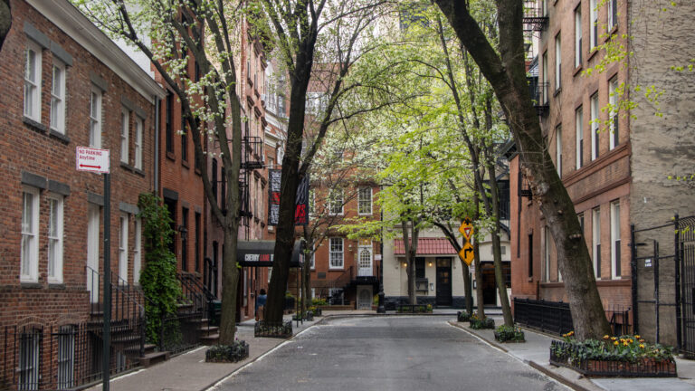 Street in Greenwich Village lined with trees.