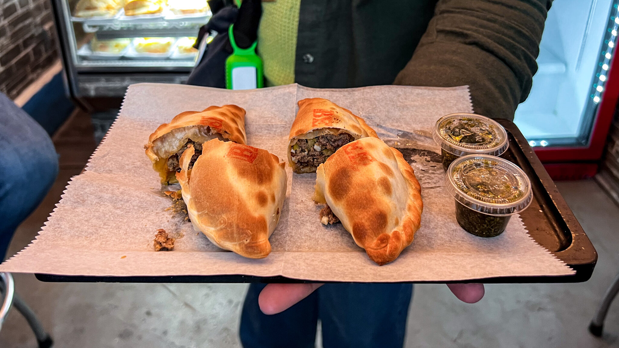 Ahoy Lower Manhattan | Krista the Explorer Argentinian empanadas on a tray NYC on a budget.