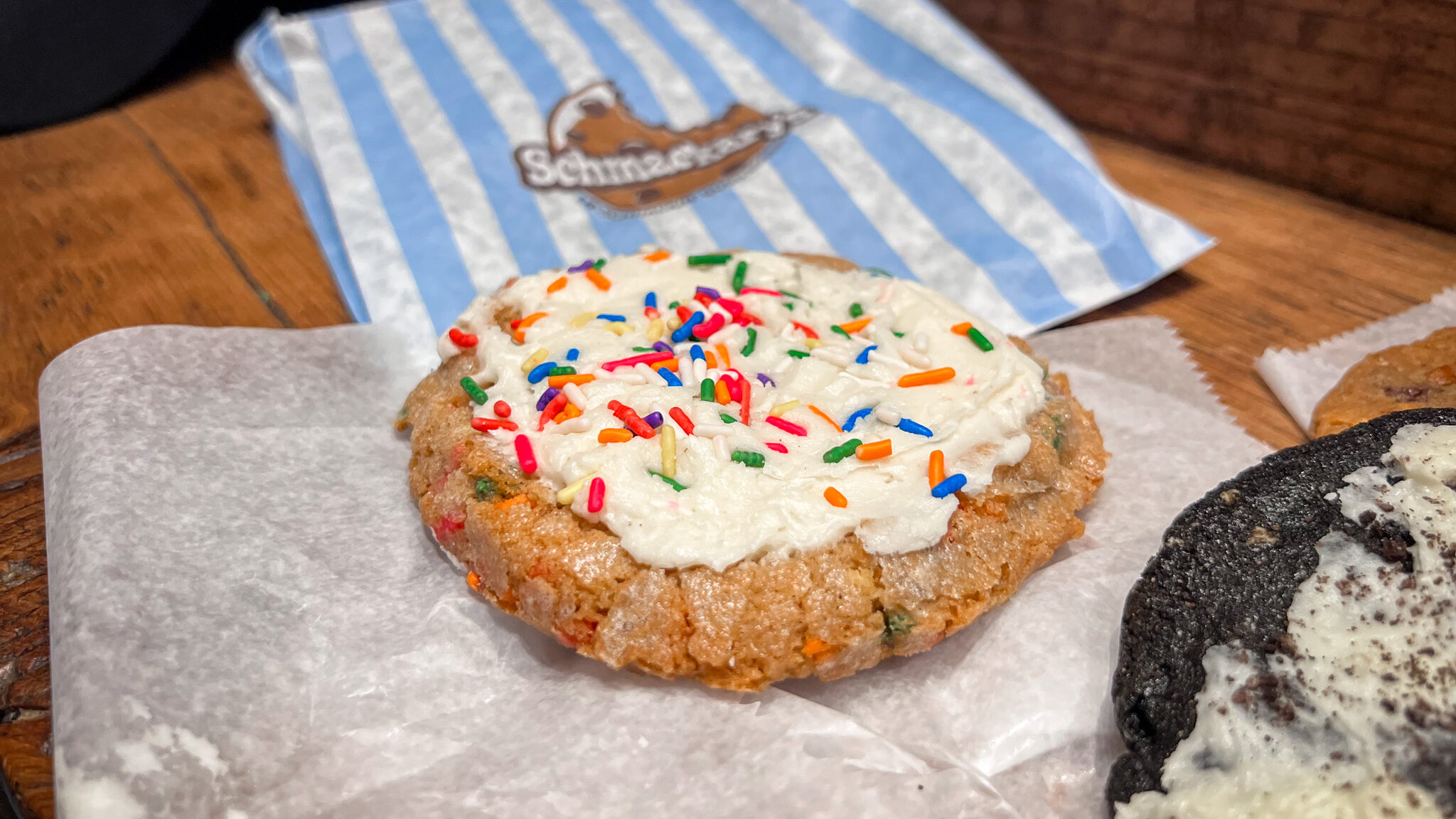 Schmackarys Manhattan | Krista the Explorer Funfetti cookie topped with white icing and sprinkles.