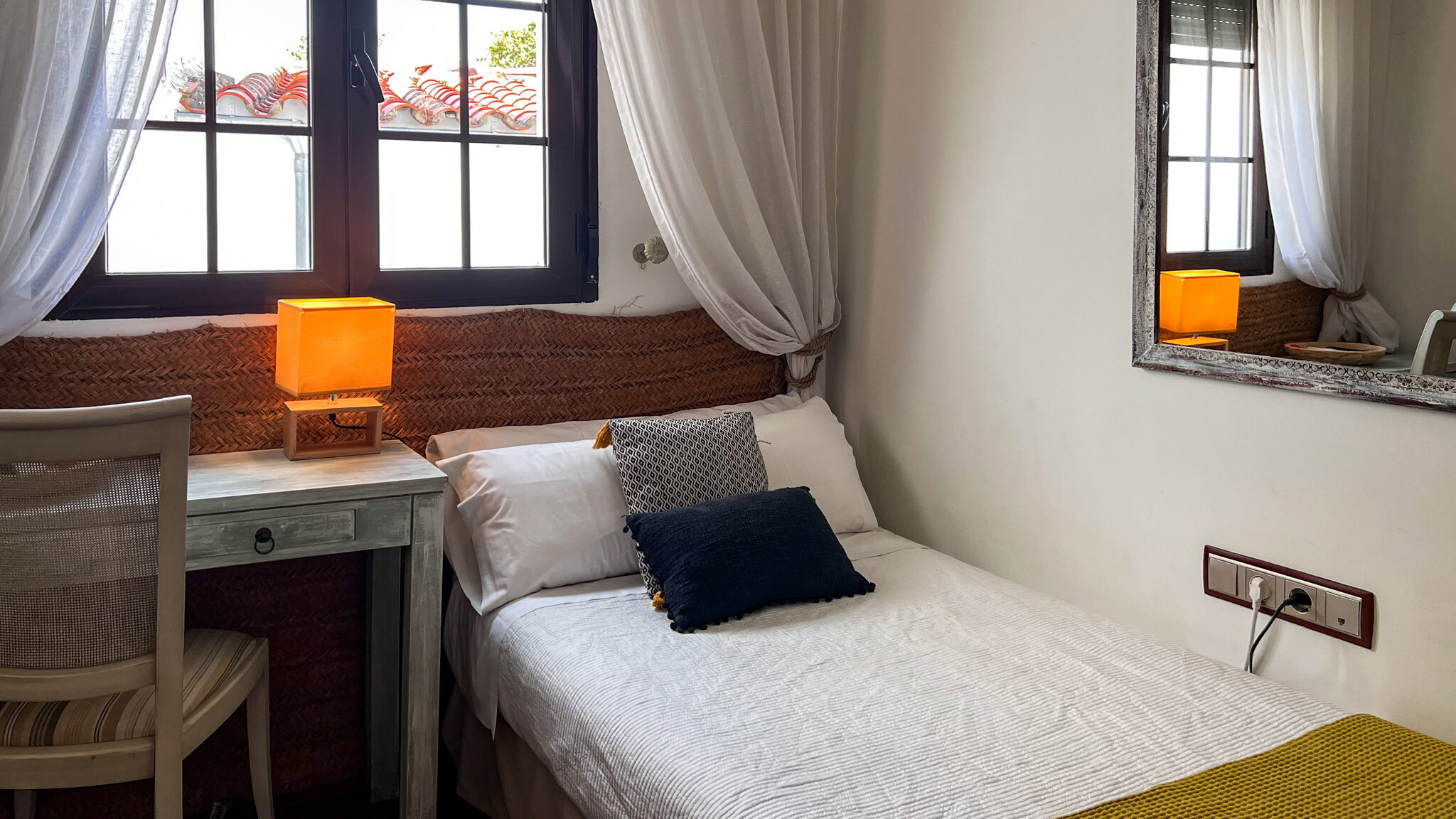 Casa Ruy Lopez Zafra | Krista the Explorer Single bed in small hotel room.