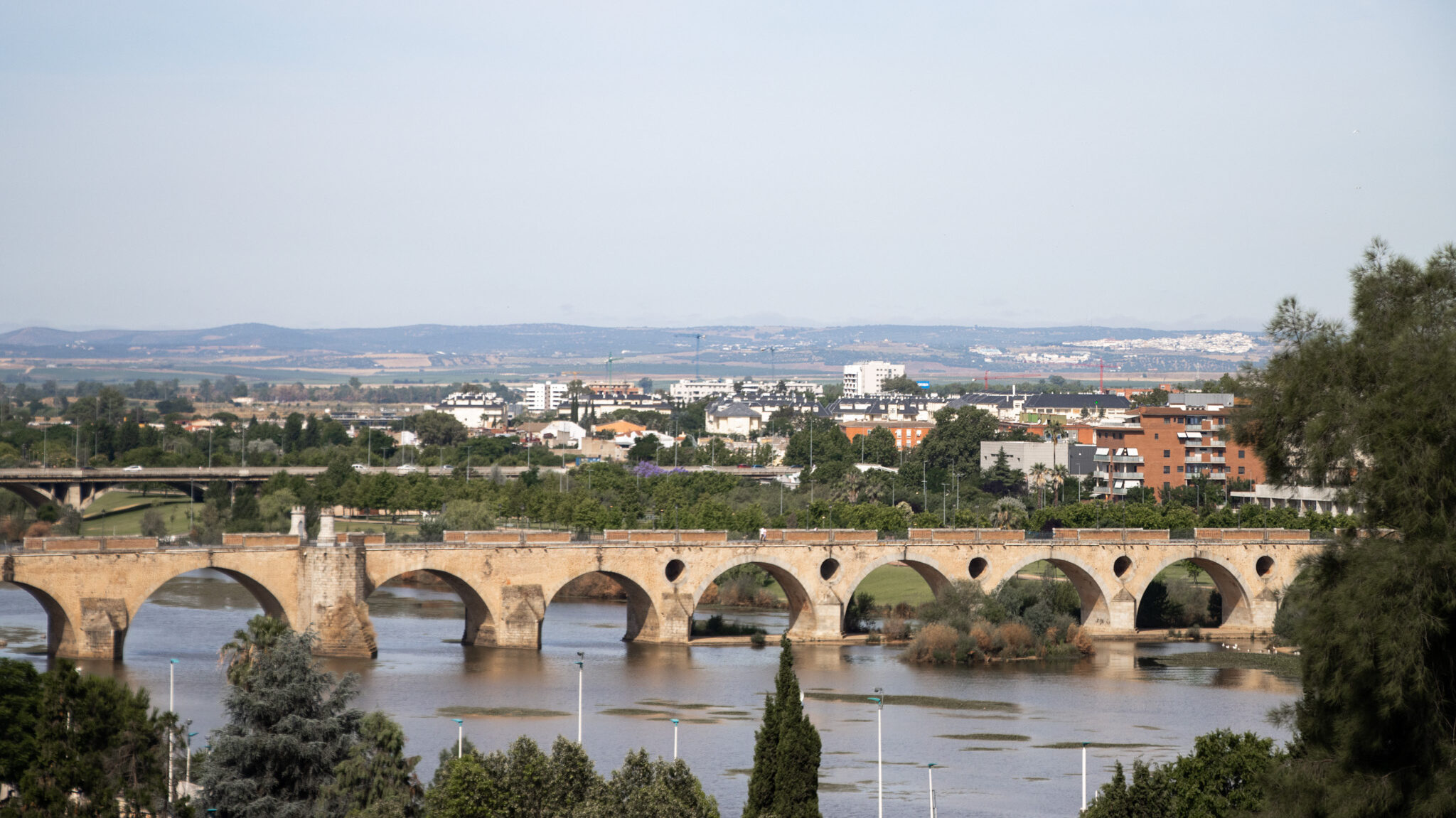 Puente de Palmas Badajoz | Krista the Explorer View of stone bridge crossing river in Badajoz.