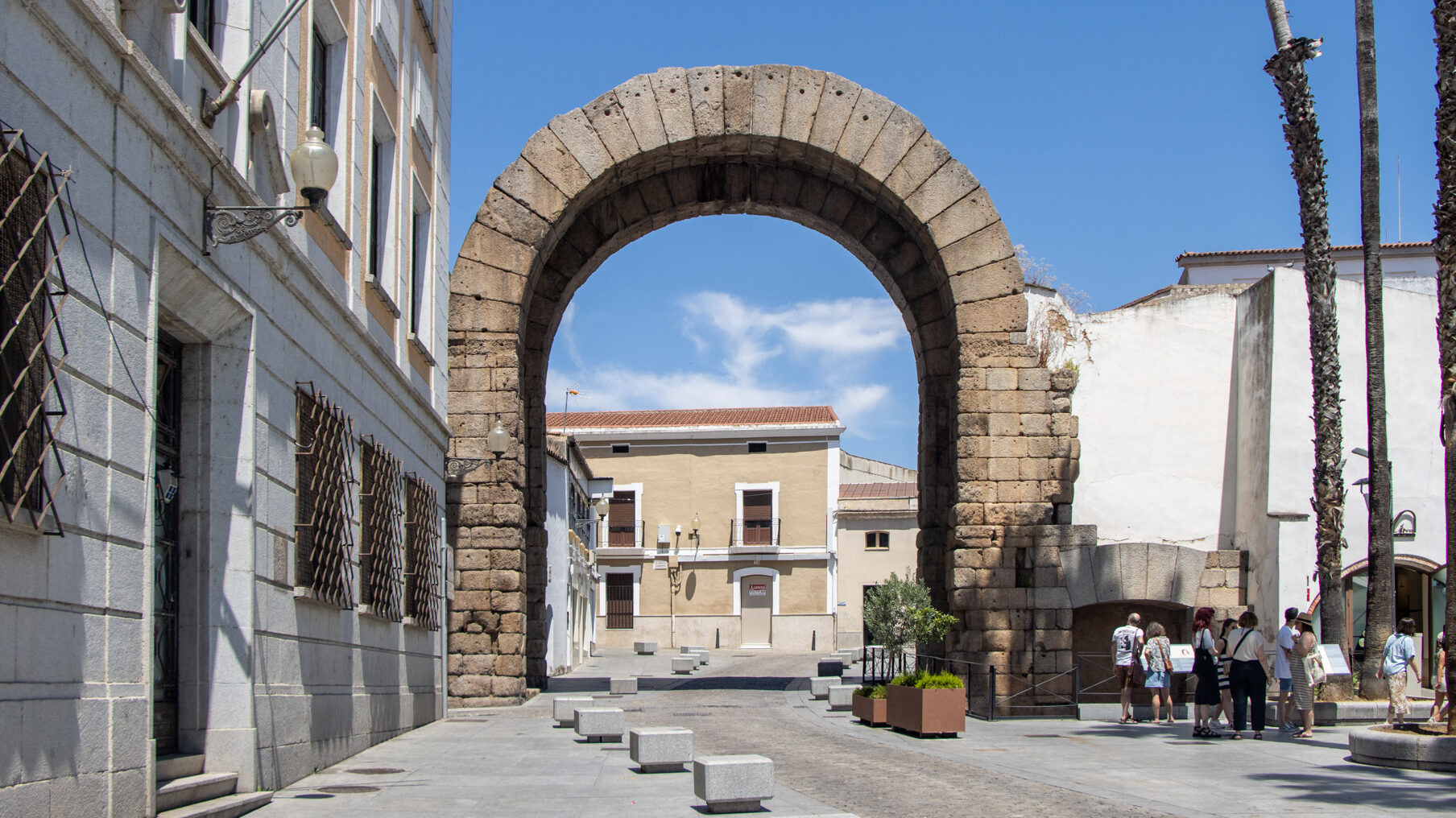 Arco de Trajano Merida | Krista the Explorer Roman brick arch surrounded by modern buildings.