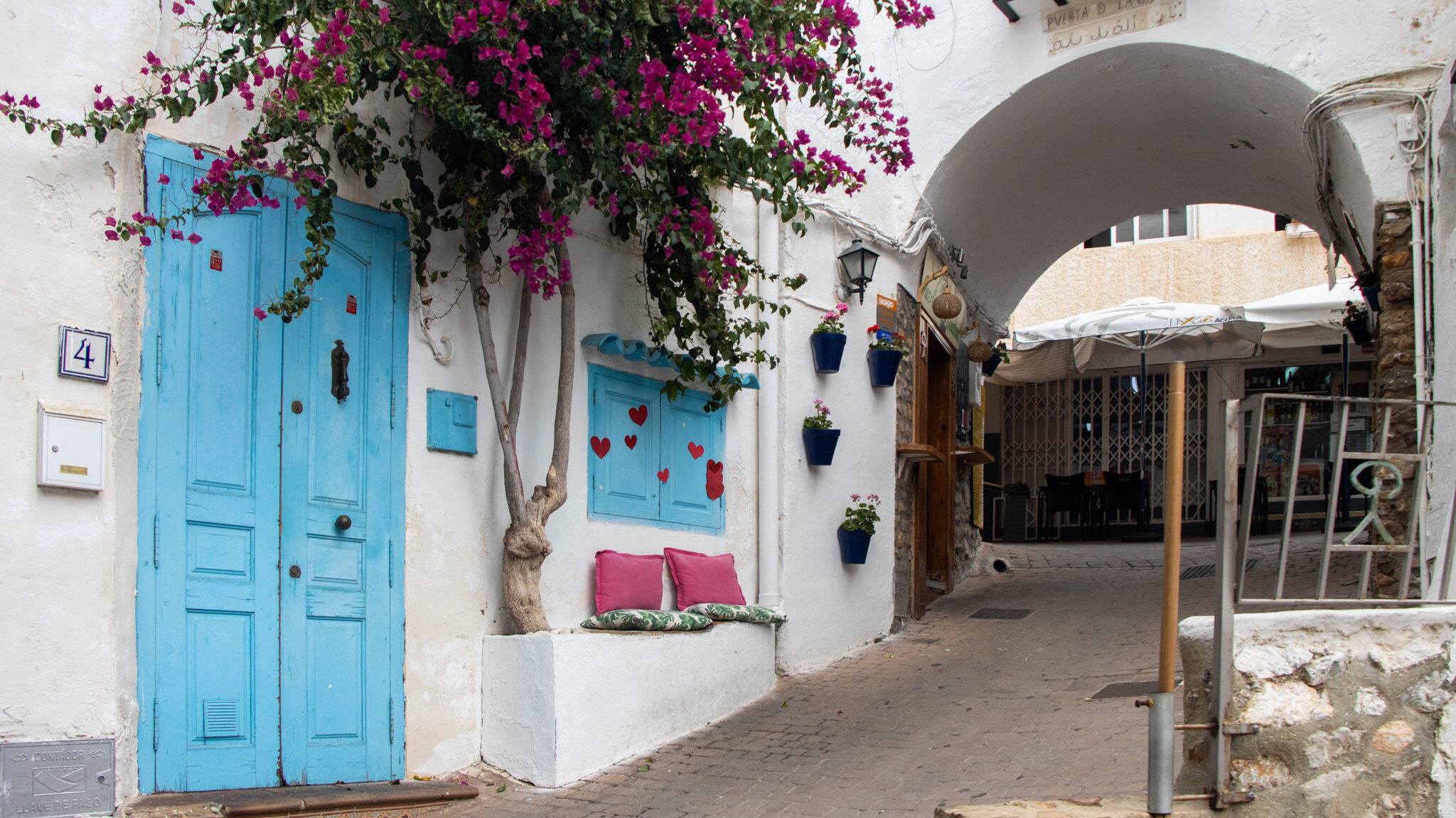 Mojacar Pueblo | Krista the Explorer Historic arch in town with blue painted door.