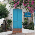 Blue door against white wall in Mojacar Pueblo.