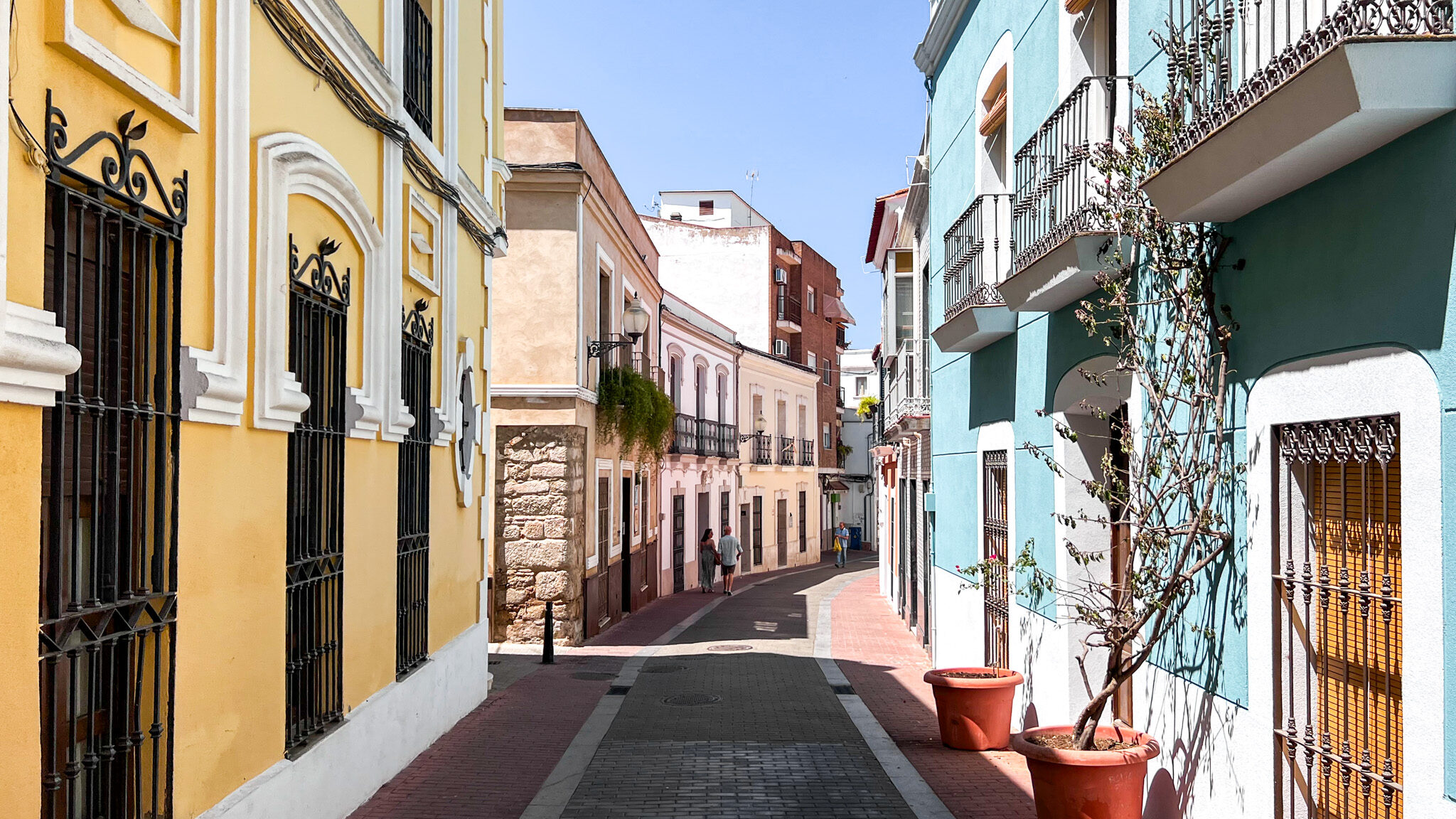 Merida Street | Krista the Explorer Narrow street lined with colourfully painted houses.
