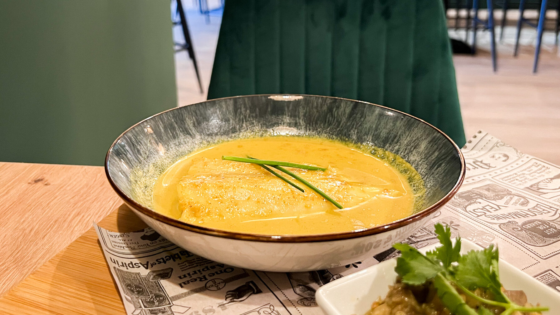 Jungle Bar Mojacar | Krista the Explorer Dish of white fish with curry sauce.