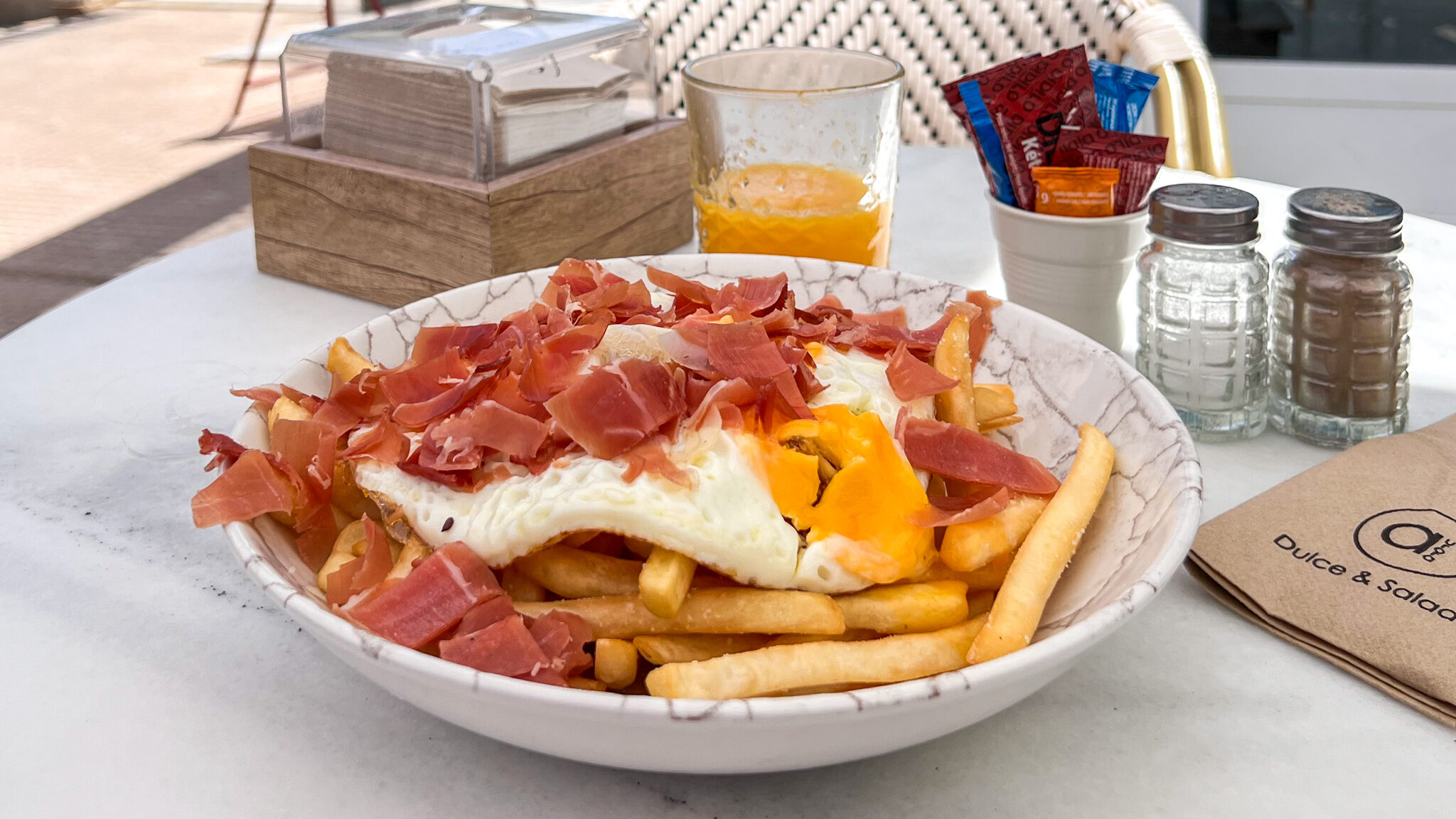 Aurora Dulce Salado Mojacar | Krista the Explorer Plate of fries with eggs and Iberian ham.