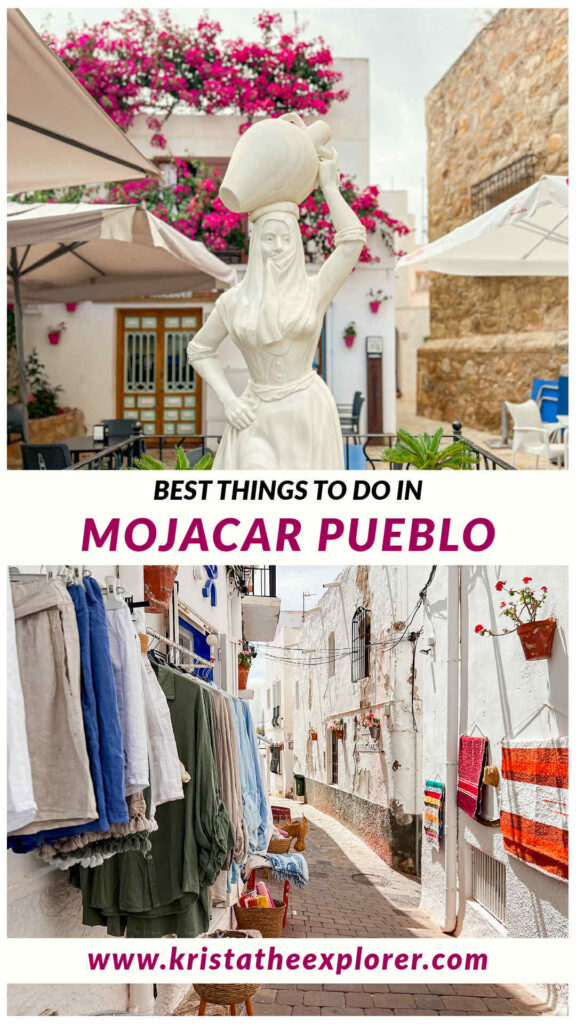 White statue of woman in village and street lined with shops.