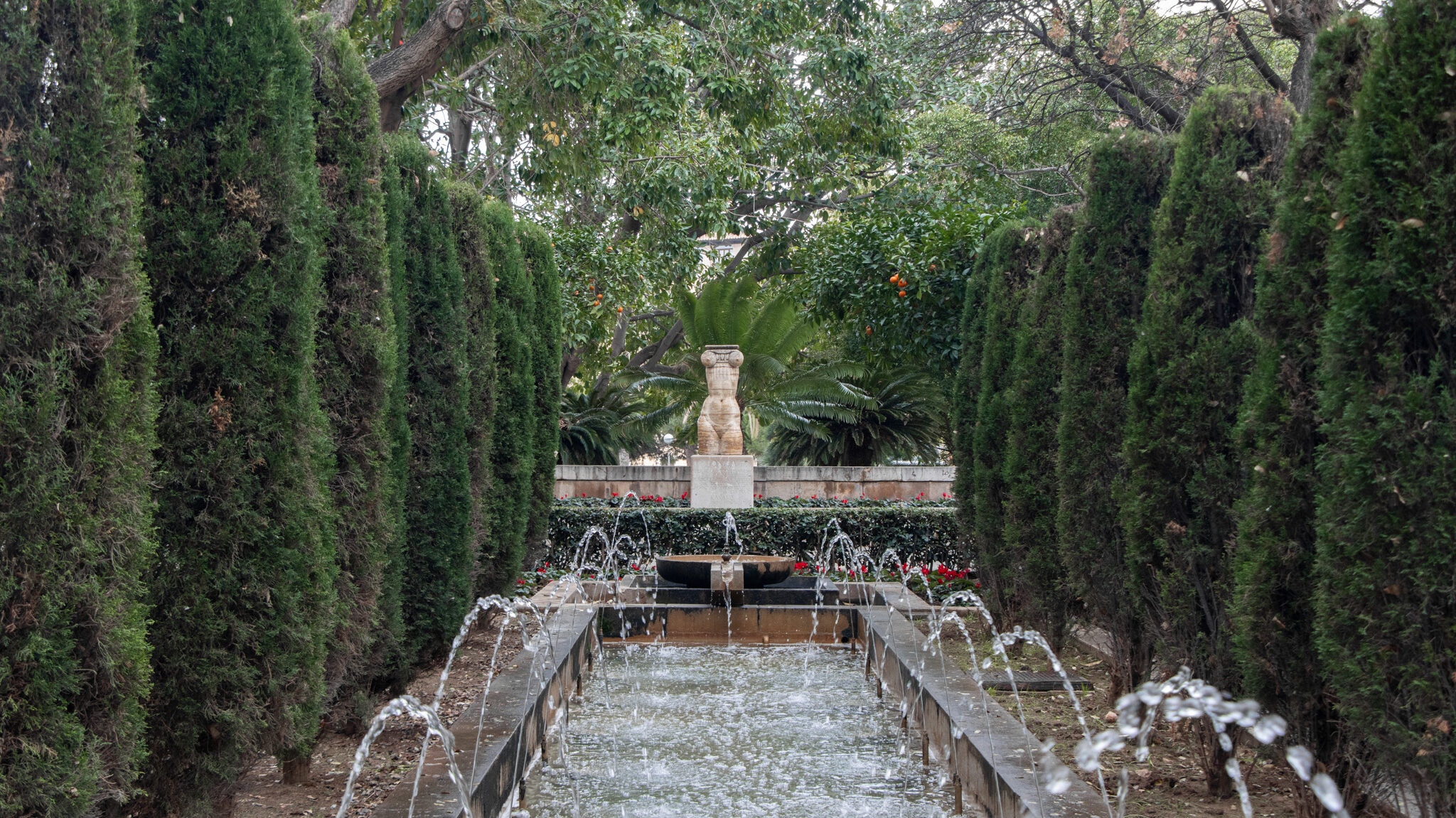 S’Hort del Rei Palma | Krista the Explorer Small garden with water features and trees.