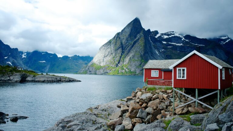 Red house on the edge of the water.