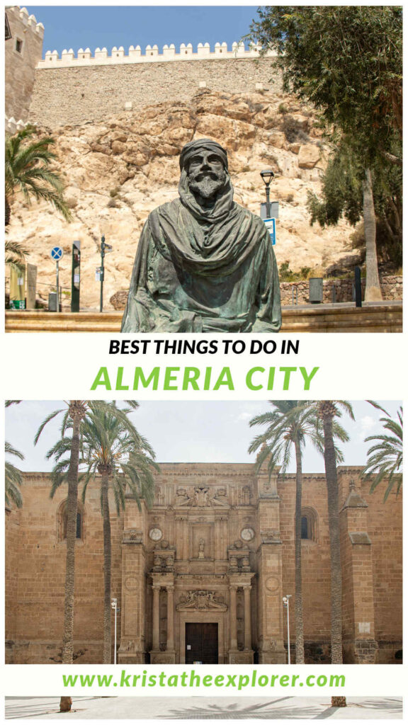 Statue in front of fortress and medieval cathedral in square.