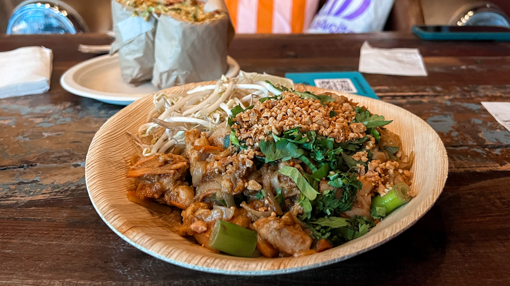 Barcode Street Food Oslo Weekend | Krista the Explorer Asian noodles and burrito on table in food hall.