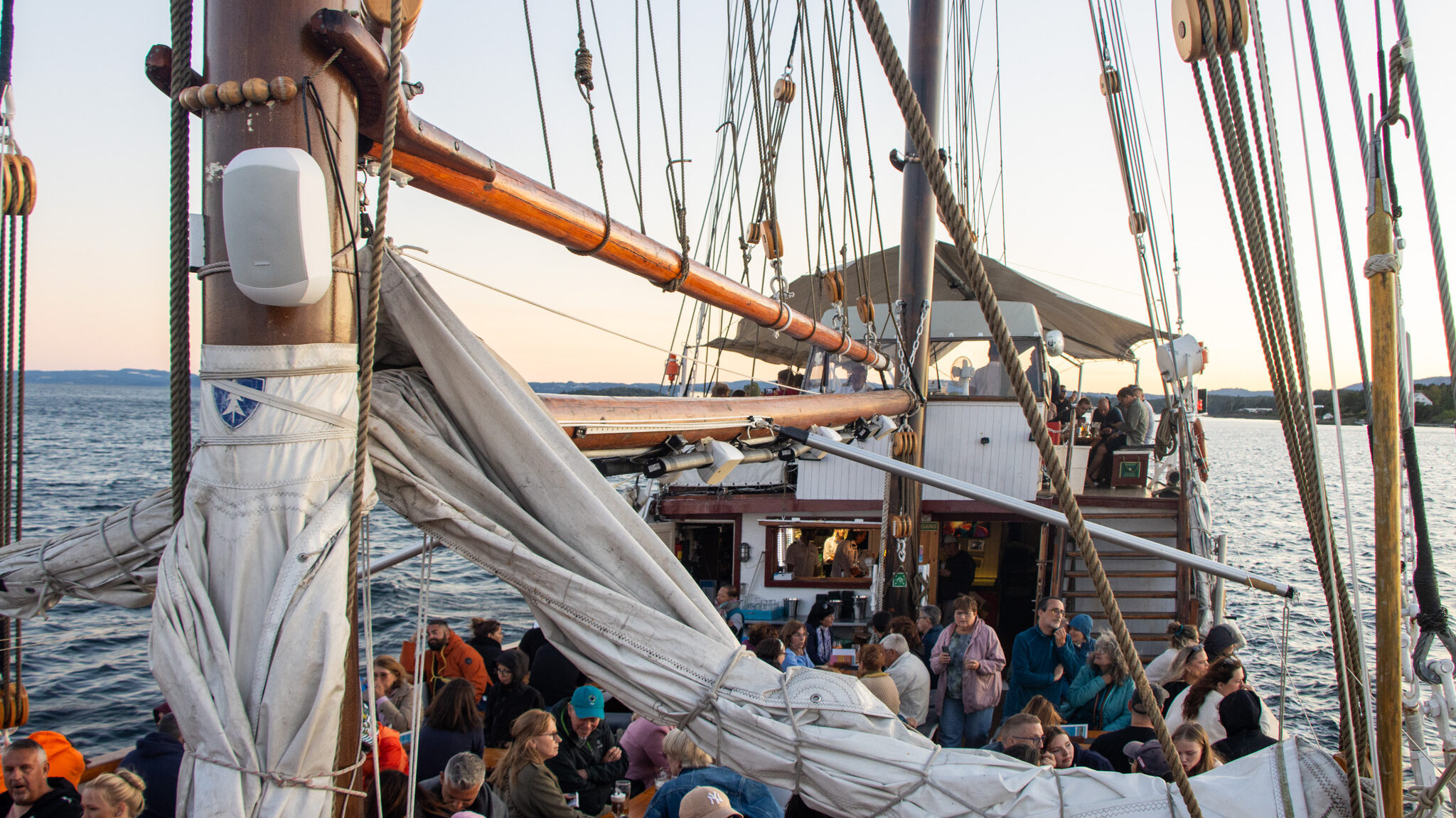 Shrimp Ship Oslo | Krista the Explorer Wooden ship with shrimp buffet cruising at sunset.