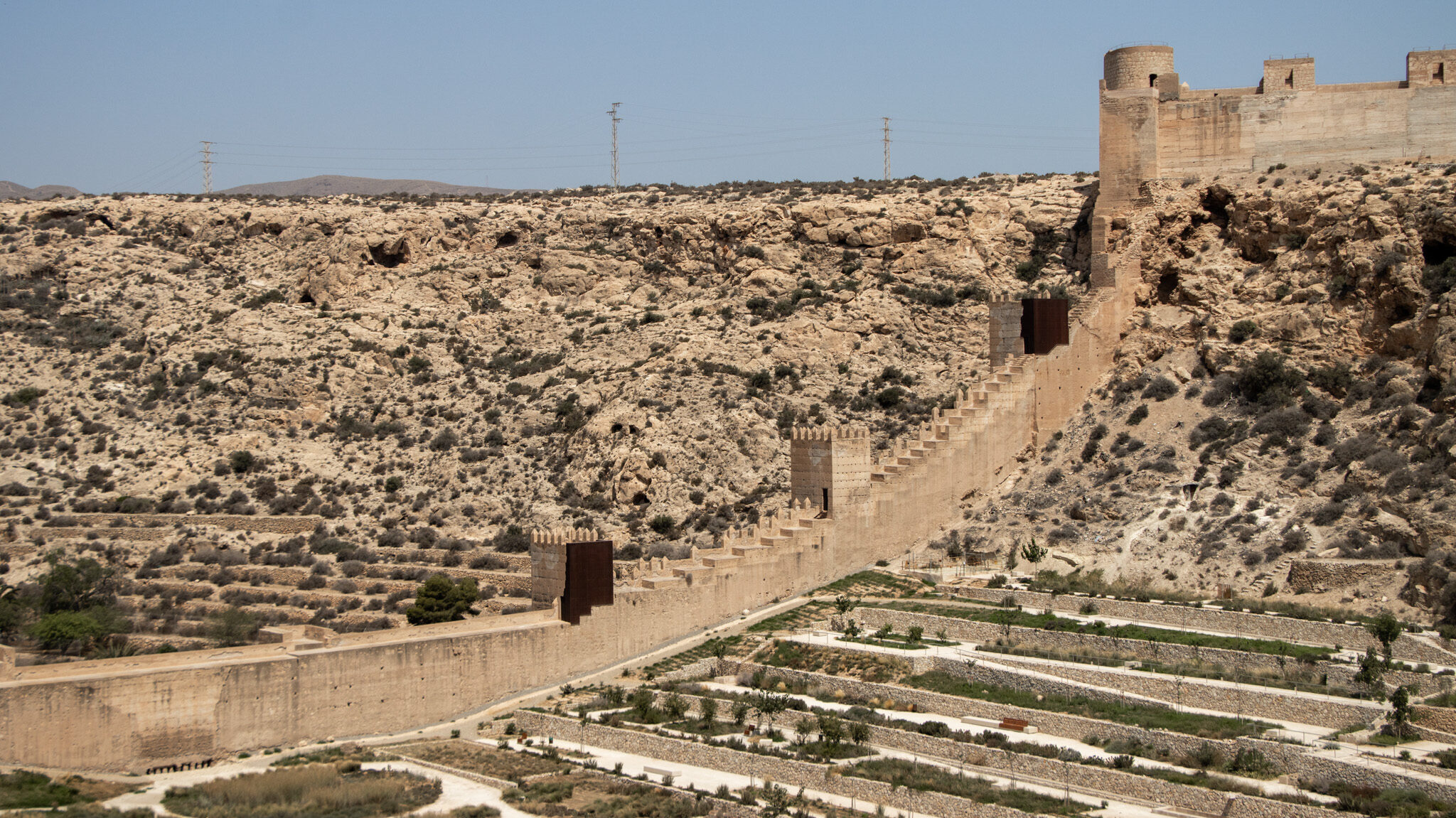 Medieval city walls connected to fortress. 