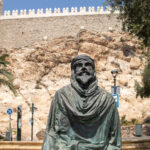 Statue of Moorish man in front of Almeria fortress.