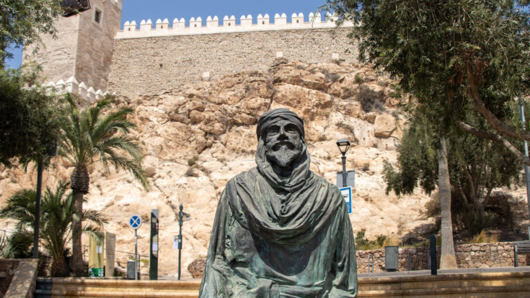 Statue of Moorish man in front of Almeria fortress.