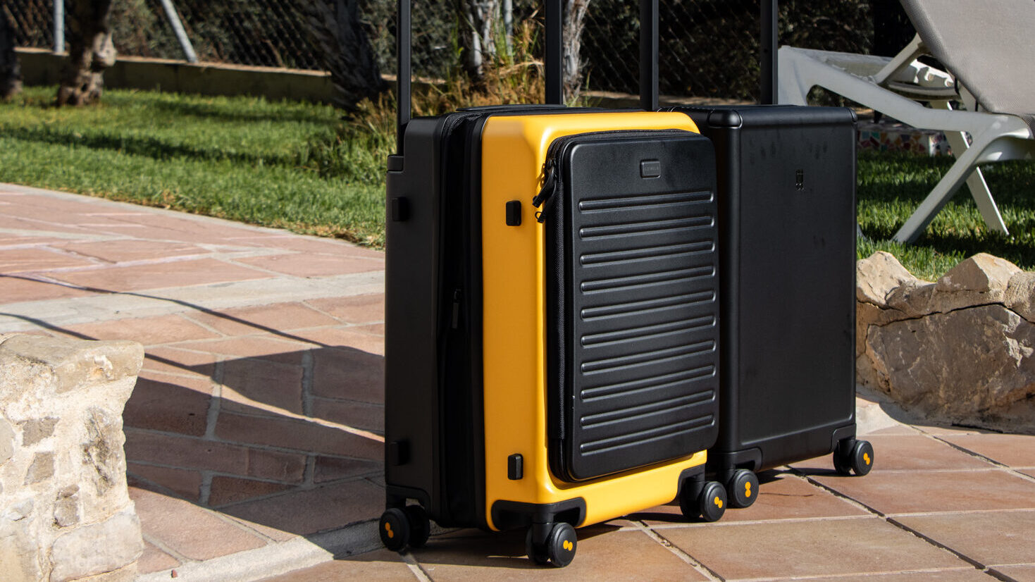 LEVEL8 | Krista the Explorer Two LEVEL8 suitcases lined up in courtyard.