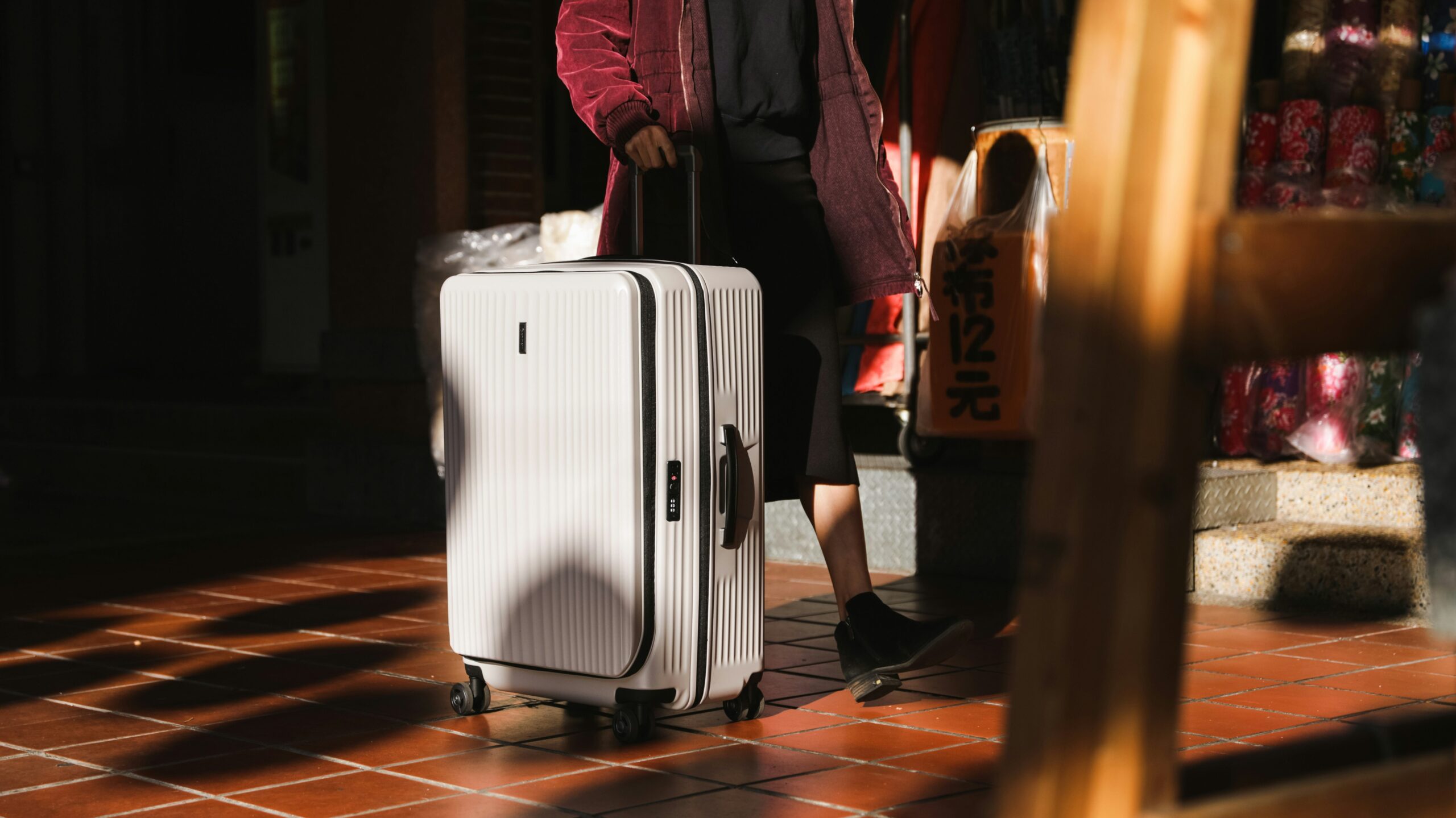 Technology Luggage | Krista the Explorer Smart luggage being rolled by traveller.