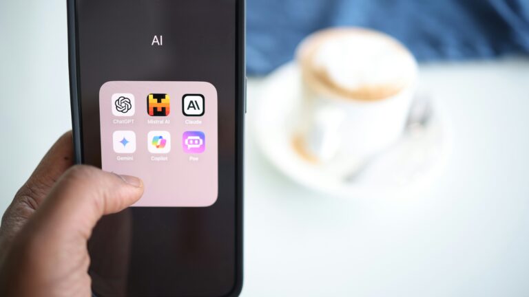 Smartphone with various AI apps in folder.