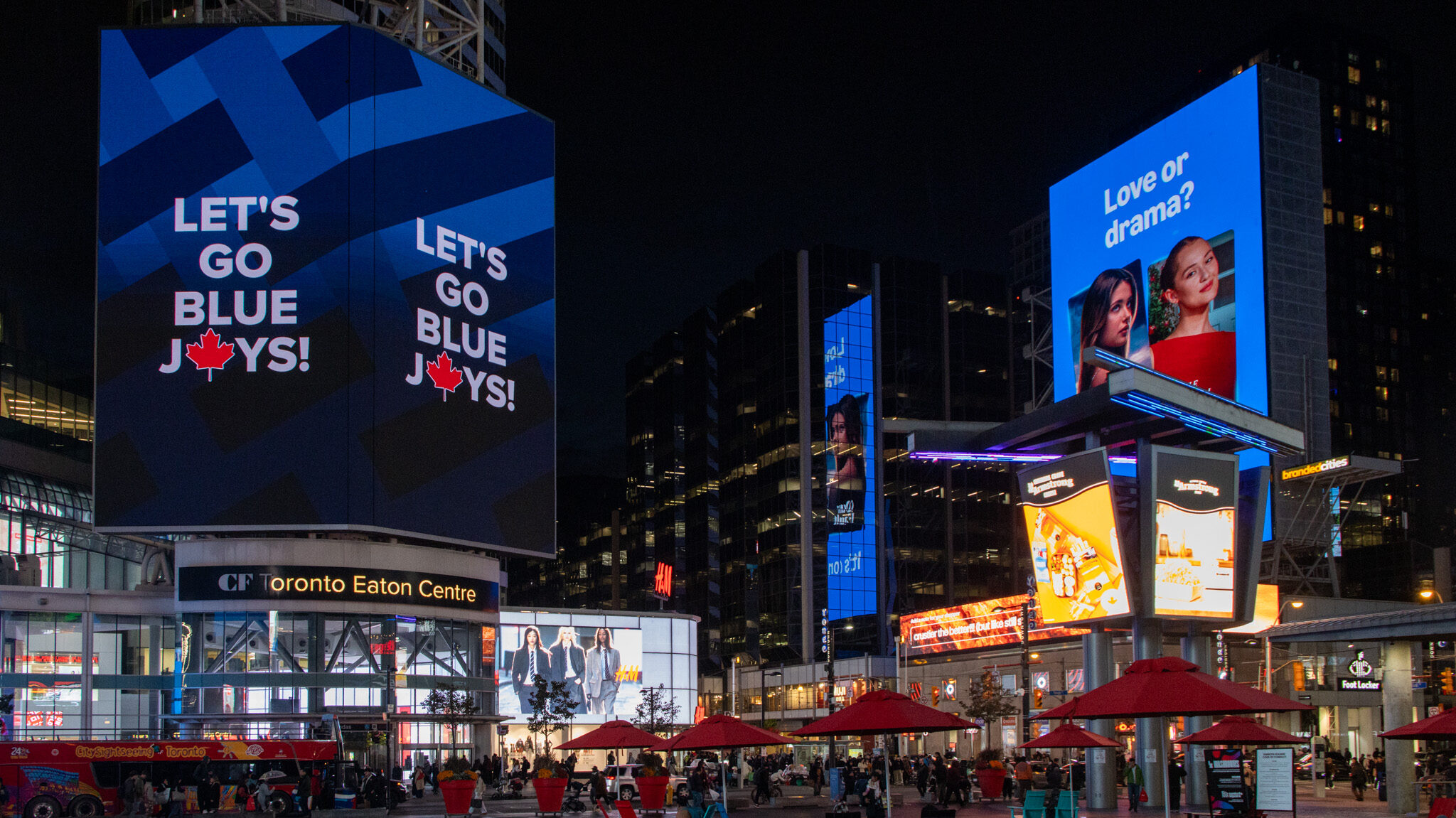 Sankofa Square Toronto | Krista the Explorer Main square in Toronto with billboards around it at night.