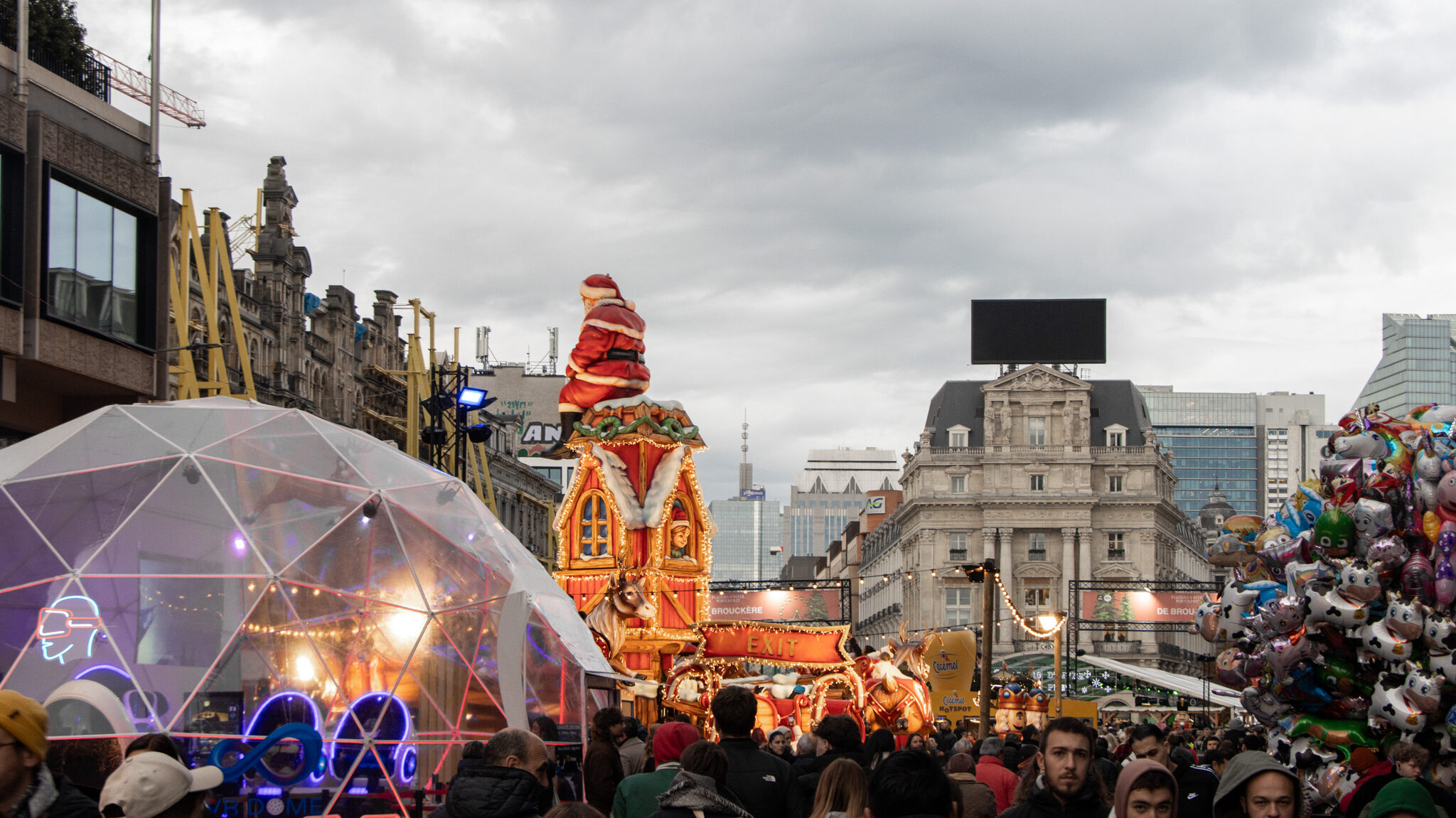 Christmas market in Brussels with dome and giant Santa.