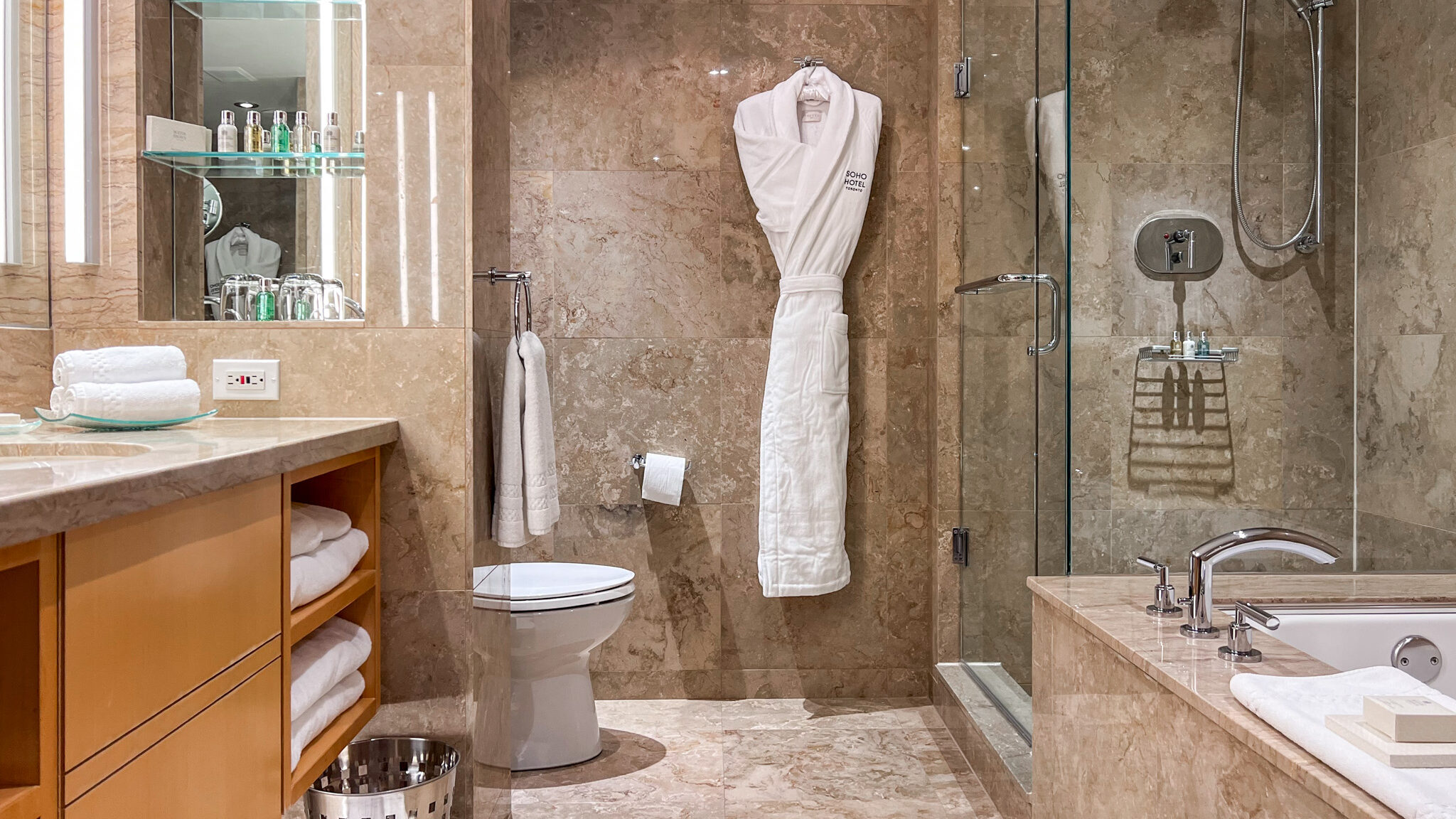 SoHo Hotel Toronto | Krista the Explorer Large bathroom with shower and tub in hotel room during a weekend in Toronto.