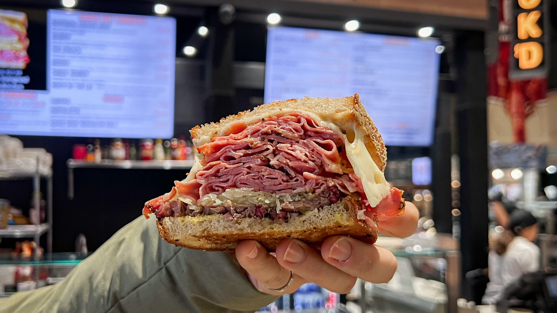Stackd Deli Kitchen Toronto | Krista the Explorer Sandwich stuffed with smoked ham and brisket.