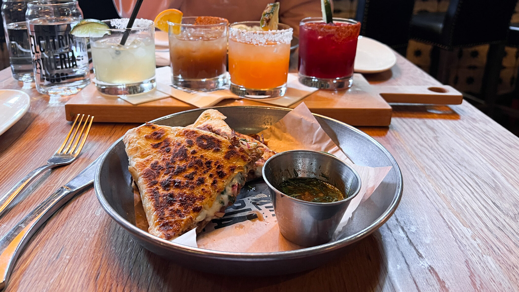 El Catrin Destileria Toronto | Krista the Explorer Chicken quesadilla served with birria dip.