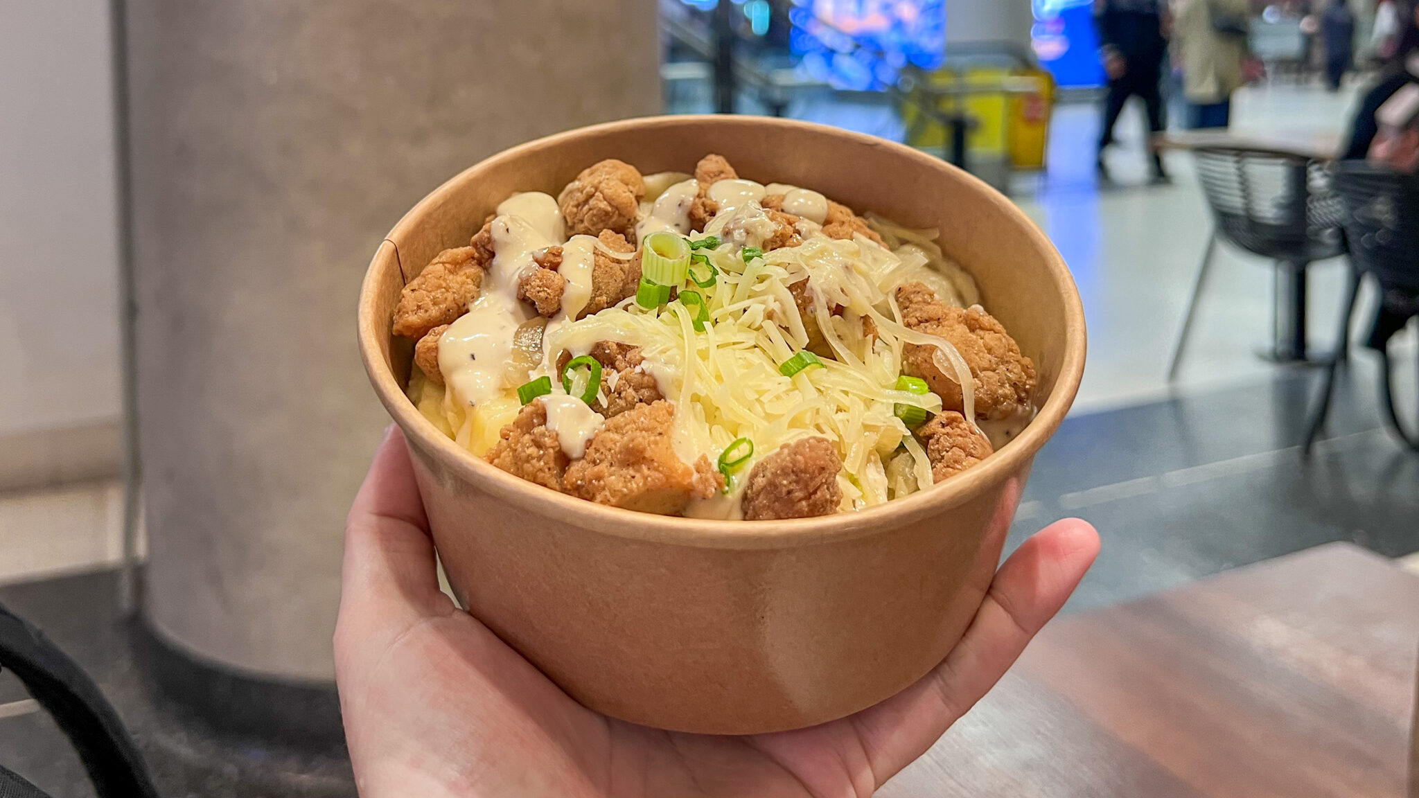 Loaded Pierogi Toronto | Krista the Explorer Bowl of perogies loaded with chicken and parmesan.