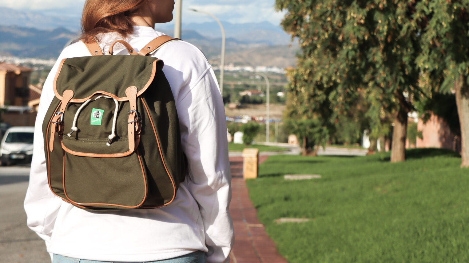 Kamarg Backpacks | Krista the Explorer Small green backpack with leather details and drawstring.