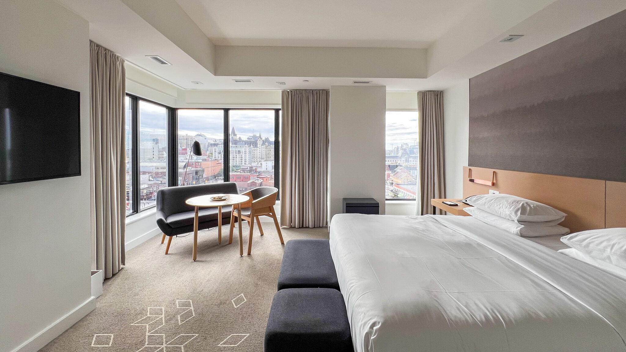 Andaz Ottawa | Krista the Explorer Large king bed in corner room of hotel.