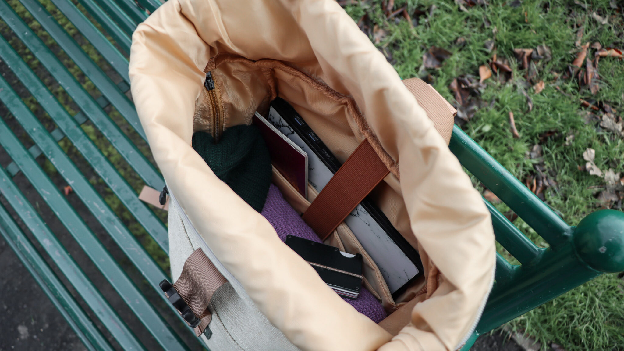 8000Kicks Backpacks | Krista the Explorer Hemp backpack with rolltop closure opened on bench.