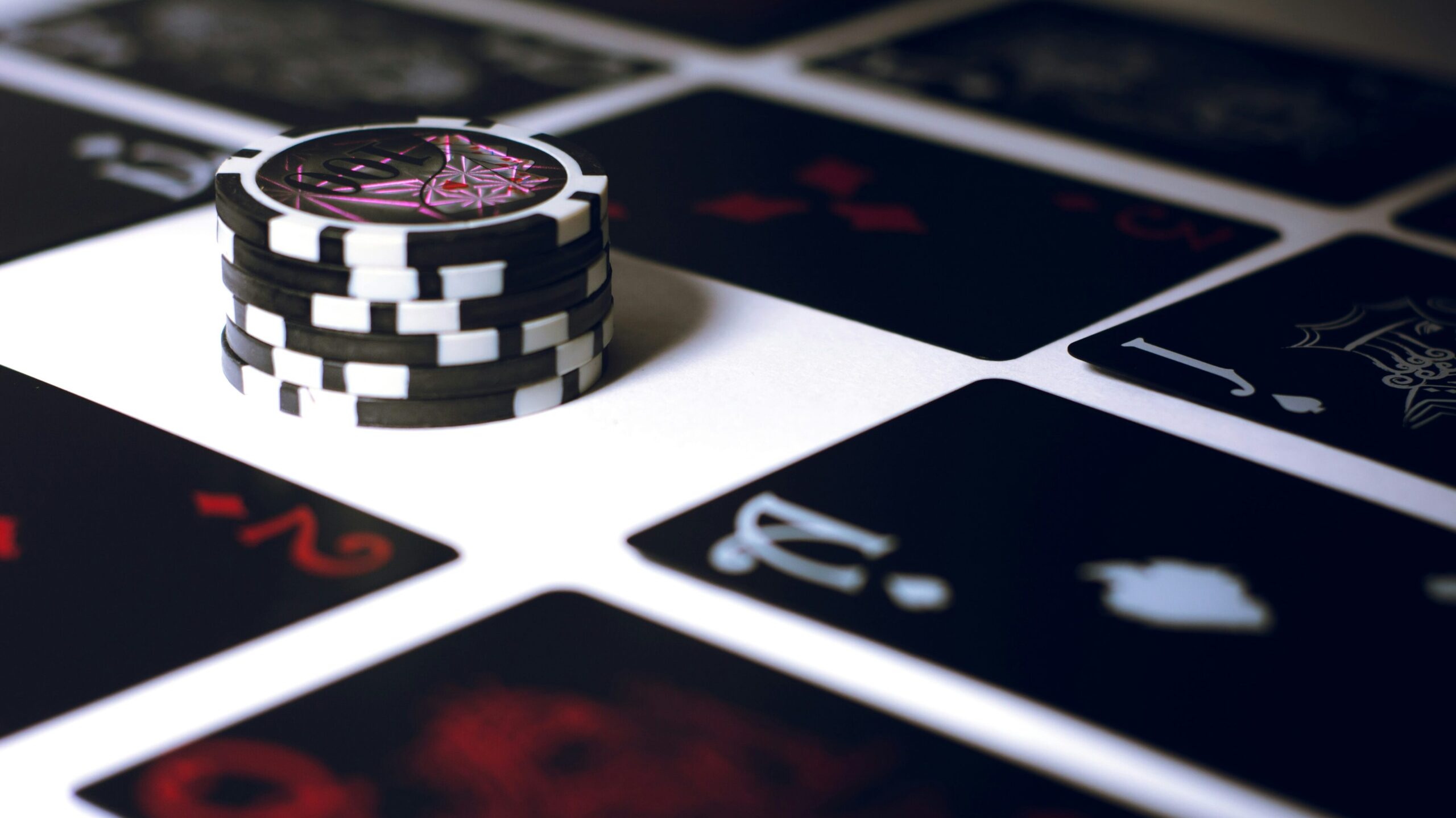 Poker chips on black and white table in resort.