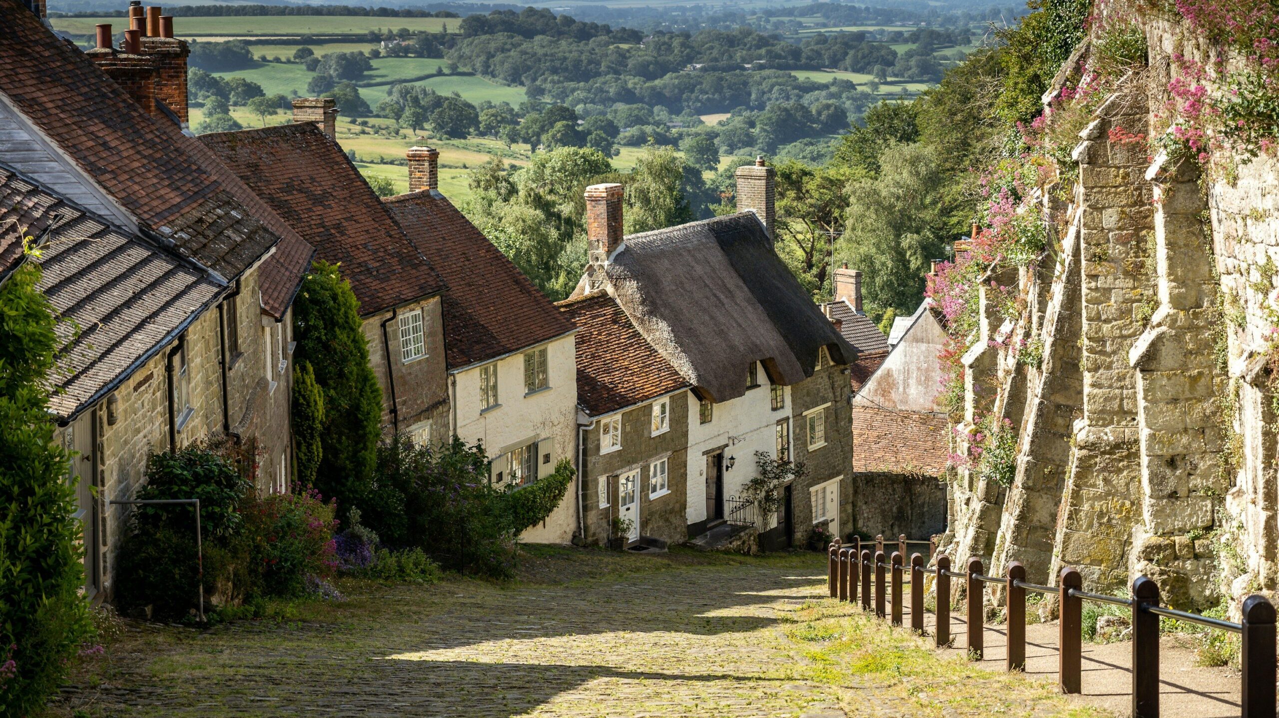 Cobbled street in English town leading downhill.