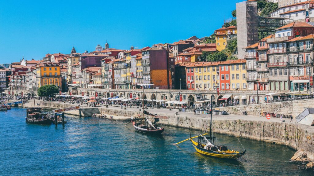 City in Portugal along the water with colourful buildings.